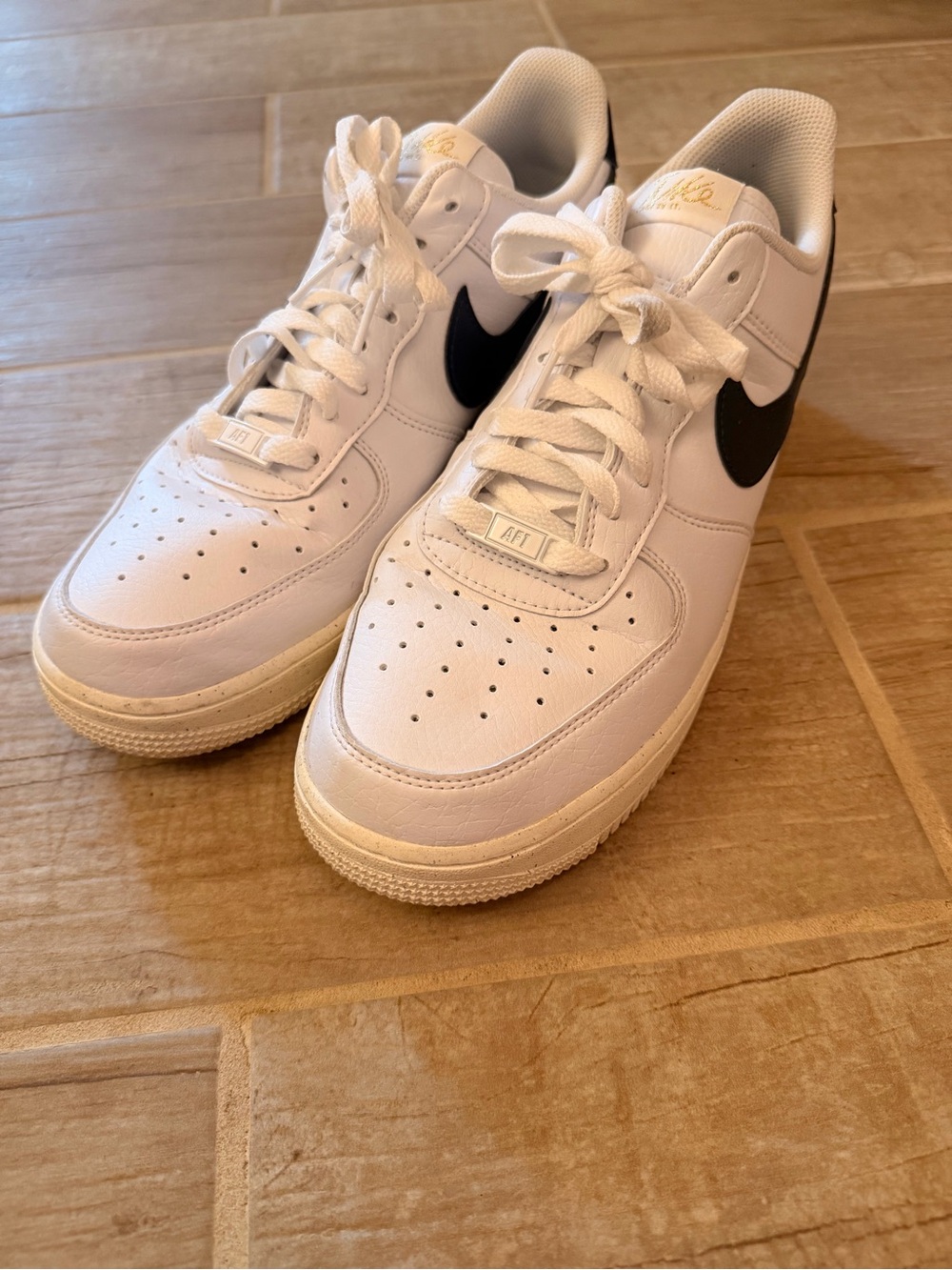 Nike White Leather Sneakers with Black Swoosh